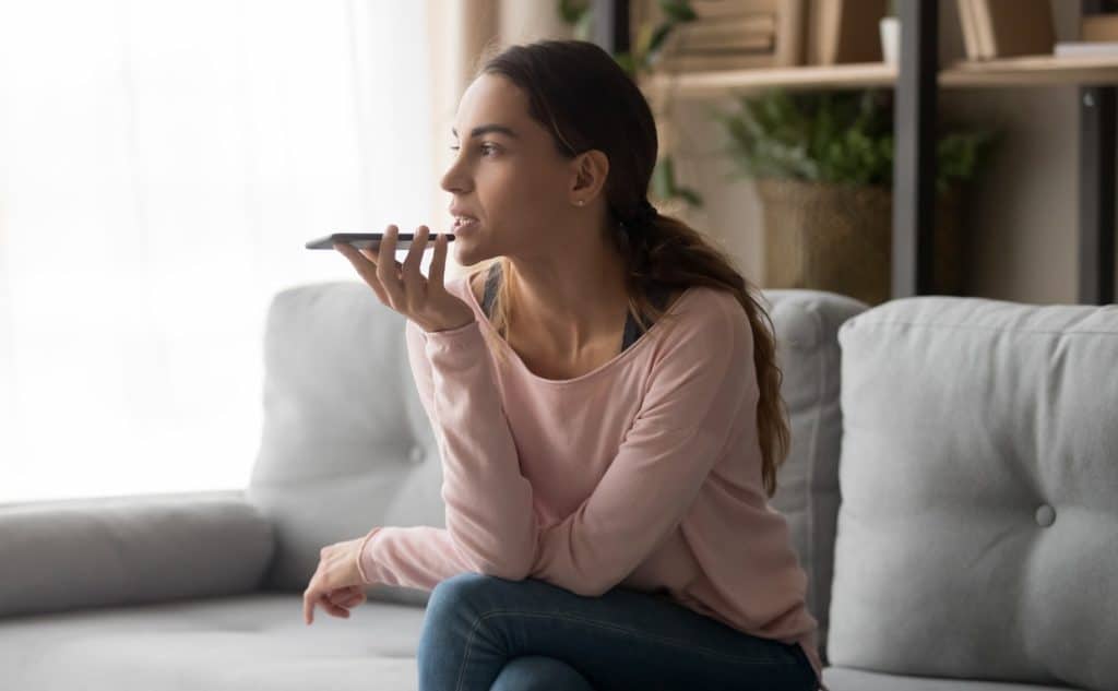 Young woman practicing speaking skills in her home