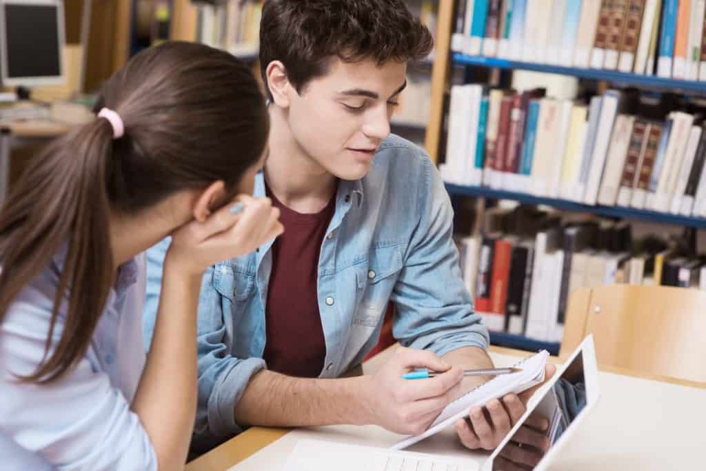 Two students helping each other out during a language class